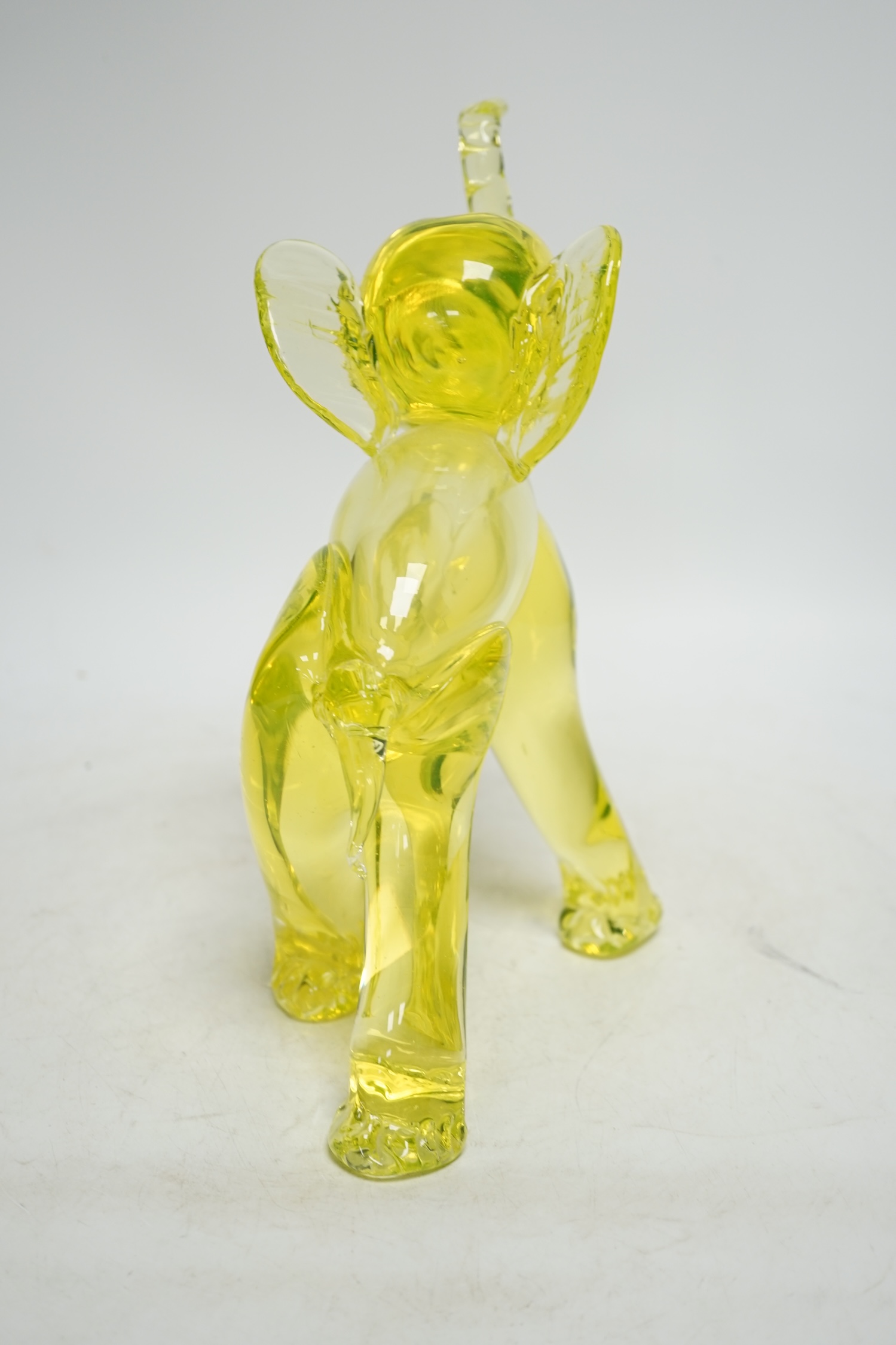 A Murano uranium glass model of an elephant, 26cm. Condition - good.